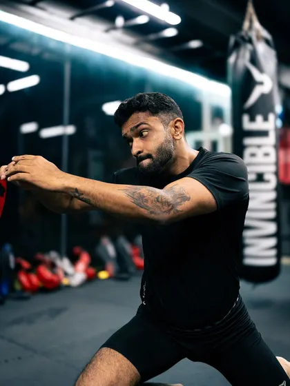 Developing core stability and rotational power with plate exercises. This kind of functional core training is essential for striking and grappling.