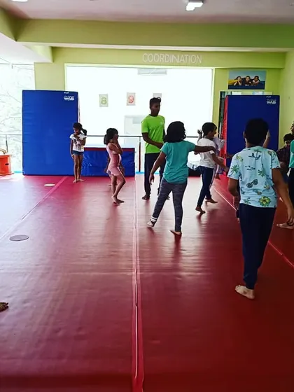 Another view of the kids enjoying a game led by an instructor. My presence ensures the games are fair, safe, and fun for every child.