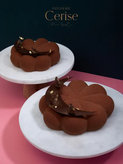 Two of my Chocolate Dreams entremets, ready for a celebration. Made with chocolate, caramel ganache, and hints of hazelnut, each bite is an experience that will leave you craving more.