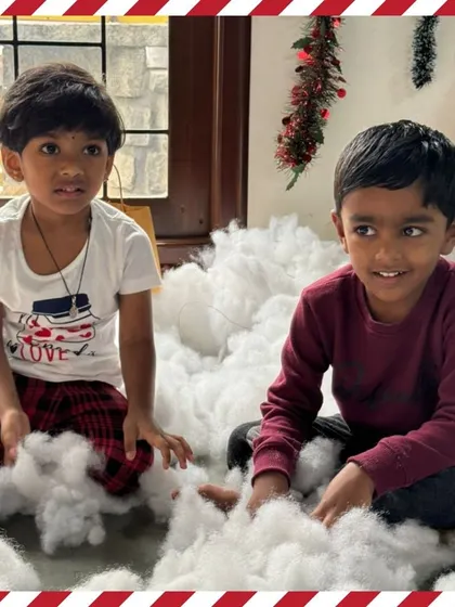 Two boys enjoying the soft "snow" during our Christmas party.