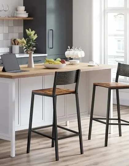 A classic farmhouse-style island with a wooden top provides a central gathering point in this kitchen. It's perfect for meal prep, serving, or working from home.