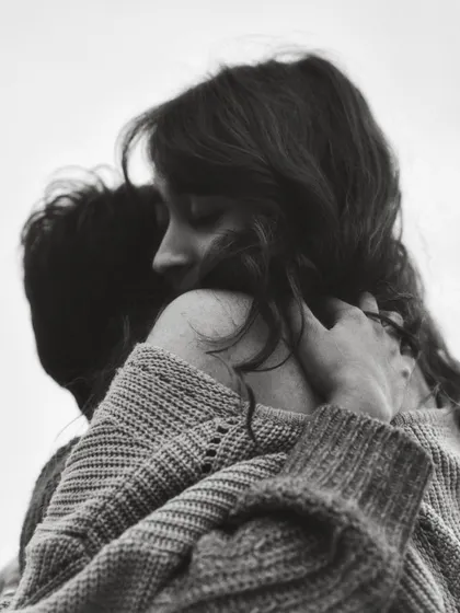 A different angle from the same intimate embrace, focusing on her serene expression. This highlights how even a small shift in perspective can tell a slightly different emotional story.