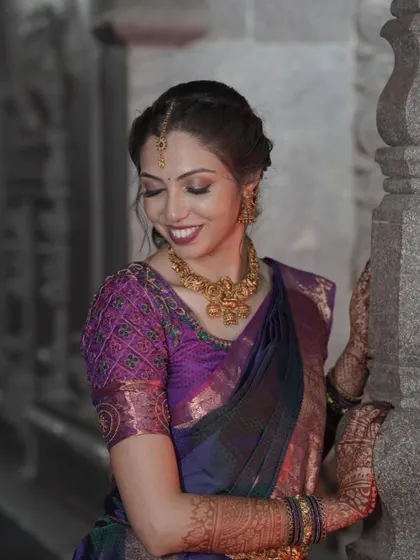 A smiling bride, looking absolutely radiant. The soft shimmer on the eyes and the glowing skin create a look that is both timeless and modern.