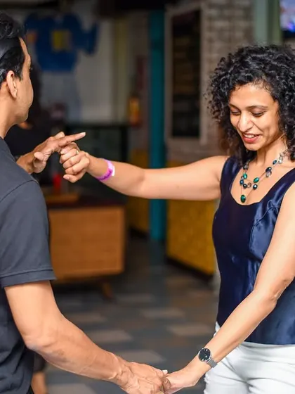 A stylish lead and follow, showcasing the elegance of social dancing. Our community is full of talented dancers.