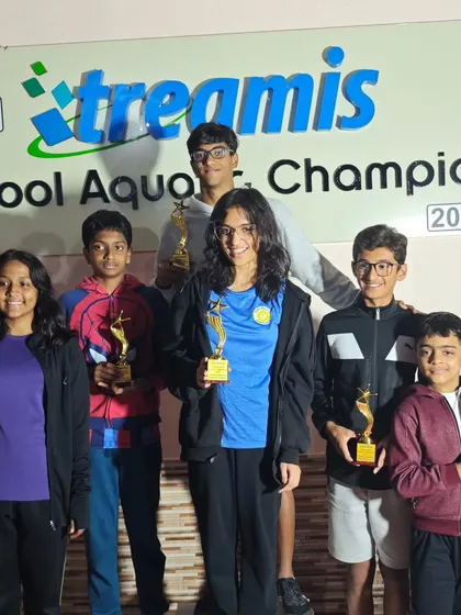 A group of our individual champions posing with their trophies. Their success is a result of consistent effort and a passion for the sport.