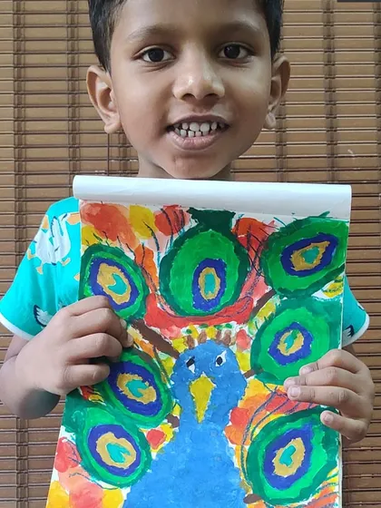This colorful peacock painting is full of energy and movement. The student used bold brushstrokes to create the texture of the feathers.