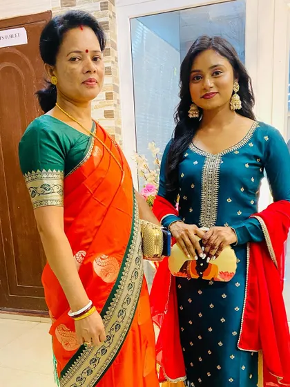 A beautiful moment captured. Our abstract portrait clutch adds a pop of color and art to this elegant teal ethnic suit.