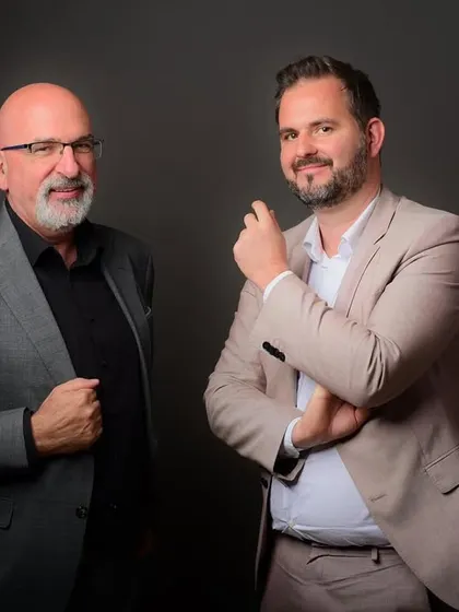 A studio shot of two colleagues. This type of portrait is great for showcasing partnership and teamwork within a company.
