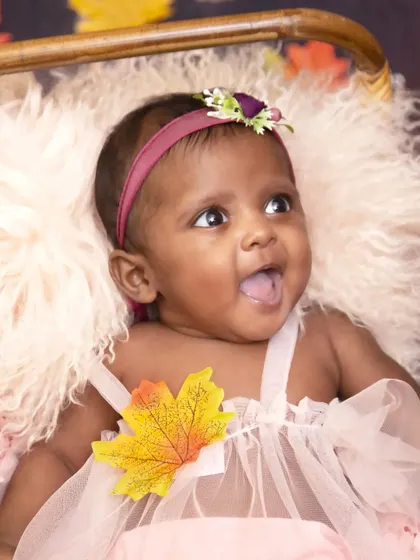 Capturing a happy, candid expression during the fall-themed photoshoot. The genuine smile shows the relaxed and fun atmosphere of my studio sessions.