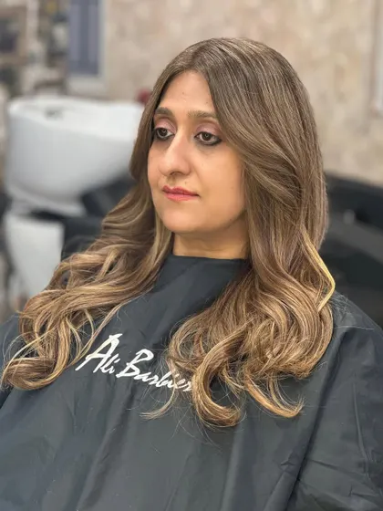 Why settle when you can have the best? This is a gorgeous blonde balayage on long hair, styled with classic waves to show off the color's dimension.