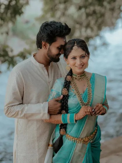 A sweet and romantic pose. The bride's traditional look is perfect for this beautiful, natural setting.