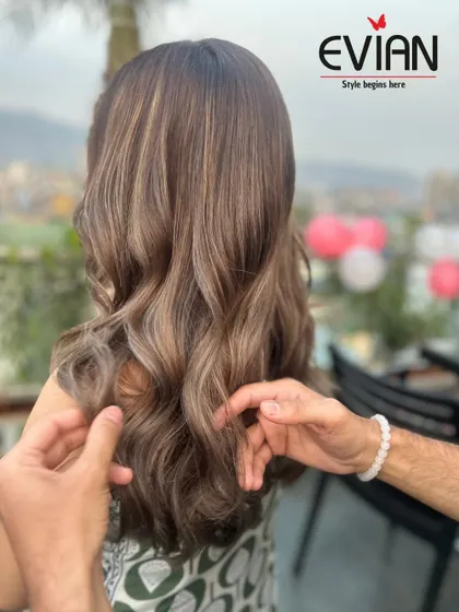 My hands at work, styling the final look. The finishing touches are just as important as the color application to ensure the hair looks its absolute best.