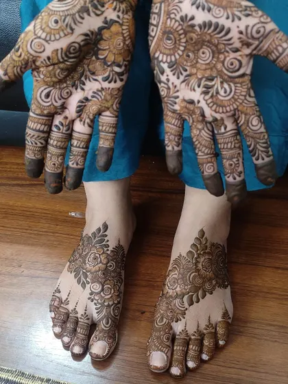 Another angle of the matching hand and feet design, showing the intricate details on both.
