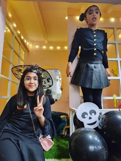 A witchy welcome! I make sure there are plenty of great spots for kids to pose for photos in their amazing costumes, like this one in our little playhouse.