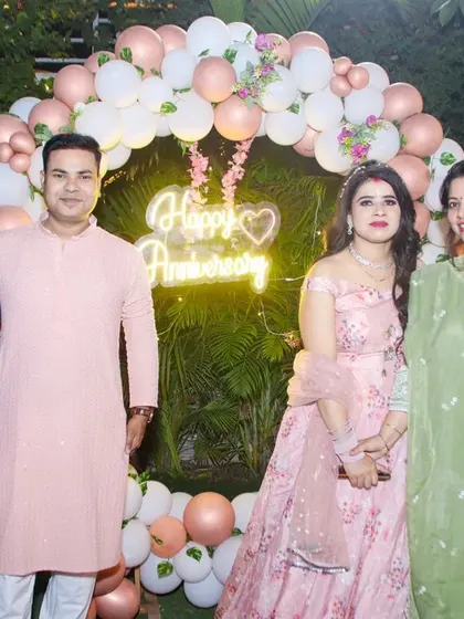 A group of friends and family celebrating together at an anniversary party. We are skilled at organizing and shooting group photos that capture the fun and togetherness of your special occasion.