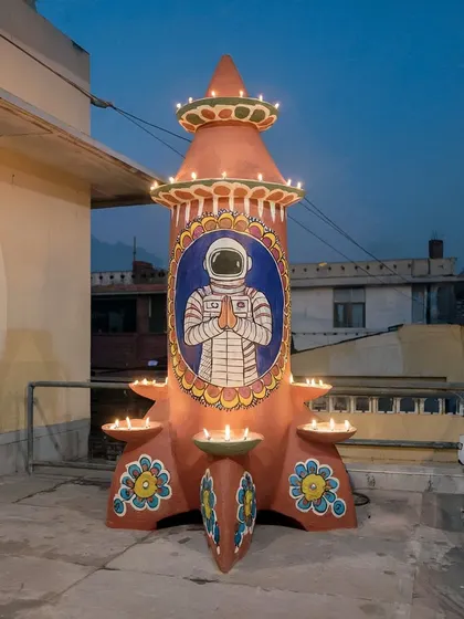A rocket-shaped 'Jwālāsthal' or lamp-stand decorated for Diwali in 'Rocketganj'. This shows how the culture of the town adapts, blending religious tradition with the iconography of space travel.