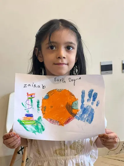Another beautiful and unique interpretation of our Earth Day theme. The handprints are a lovely personal touch.