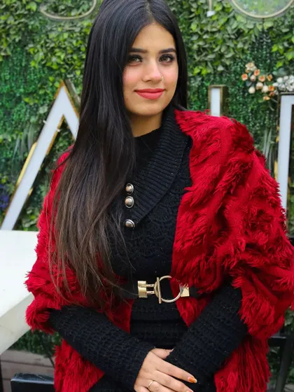 Kicking off a winter series shoot at a rooftop cafe. The combination of the cozy knit dress and the bold red faux fur wrap creates a perfect look for a chic, cold-weather portrait.
