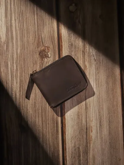 The wallet shot from above, with strong shadows creating a graphic and visually interesting composition.
