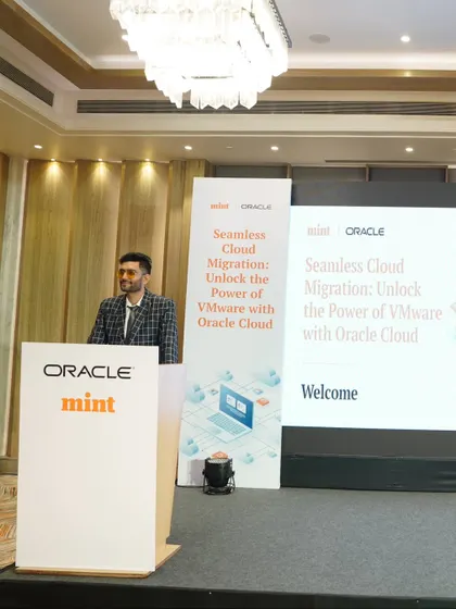 A wide shot of the stage at the Oracle and Mint summit. I am experienced in managing large stages and ensuring a smooth experience for both speakers and attendees.