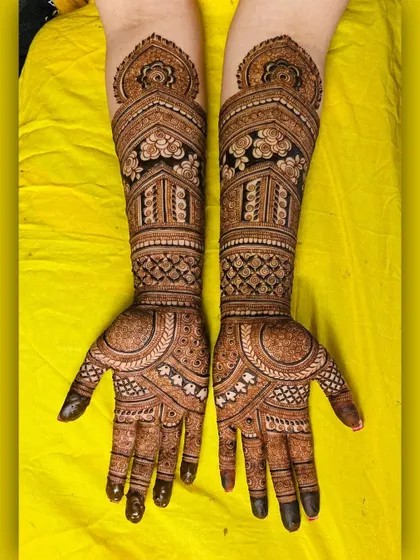 A full-arm design with a mix of bold architectural shapes and delicate floral patterns. The contrast between the dark-filled areas and fine lines is striking.