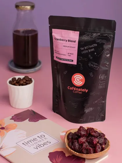A bright and summery product shot for Cafenately's Cranberry Blend coffee. The styling helps position the product as a refreshing and seasonal choice.