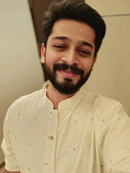A simple and pleasant close-up shot in a light-colored kurta. This type of image works well for brands that want to showcase a natural and relatable look for their men's ethnic collection.