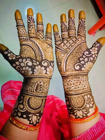 A beautiful floral mehandi design where flowers are the main theme, covering the palms and wrists in a garden-like pattern.