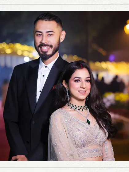 A classic couple portrait from a reception or engagement. The soft lighting and elegant attire make for a timeless and sophisticated photograph.
