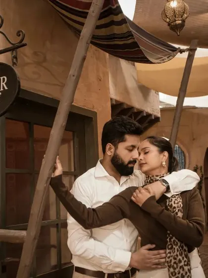 A romantic embrace in a stylized alleyway designed to look like a Middle Eastern souk. This showcases our ability to create a destination feel even in a studio setting.