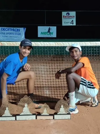 Tavish Pahwa and his doubles partner Hruthik Katakam after the finals of the Asian Under 14 tournament in Ahmedabad, showcasing their trophies.