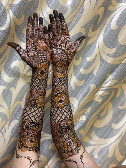 This is a detailed view of my intricate bridal henna work. Each design is unique, combining traditional patterns like paisleys and mandalas with fine-line fillers to create a stunning, full-coverage look for your special day.