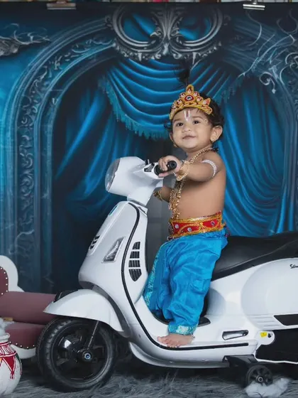 This modern Krishna is ready to ride his scooter, a fun twist on the traditional theme.