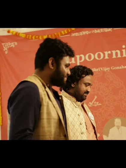 A candid moment with a fellow artist at the Gurupoornima event. The sense of community and shared respect among musicians is one of the best parts of this journey.