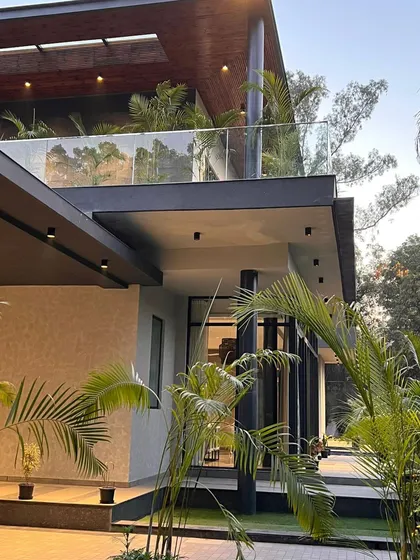 The layered balconies and terraces of "The One" are accentuated with warm lighting, including integrated lights in the planters. This technique adds depth to the facade and ensures the greenery remains a vibrant feature even after sunset.