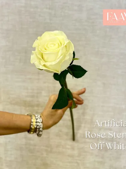 A single, perfect off-white artificial rose stem. It is ideal for a bud vase or for adding to a larger arrangement for a touch of classic elegance.