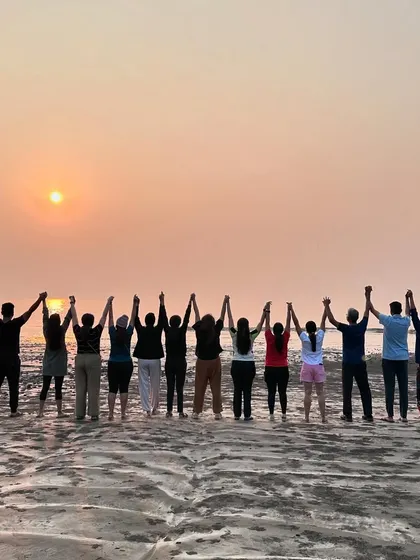 Our retreat group holding hands and watching the sunset at the beach. These are the moments we cherish.