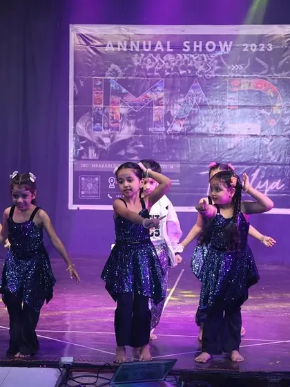 Our youngest performers in sparkling blue costumes, ready to charm the audience at the annual show.
