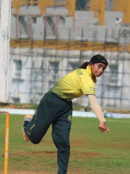 A bowler in full flow, demonstrating a powerful and orthodox bowling action.