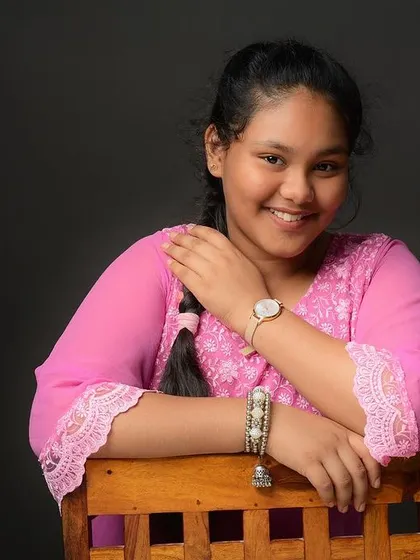A confident and happy portrait of a young girl. I work to make every person feel comfortable and at ease in front of the camera.