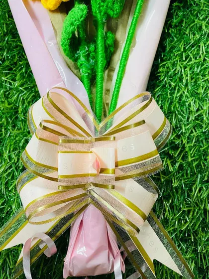 The final touch on my bouquets is a beautiful, high-quality bow that complements the colors of the flowers and the wrapping paper.