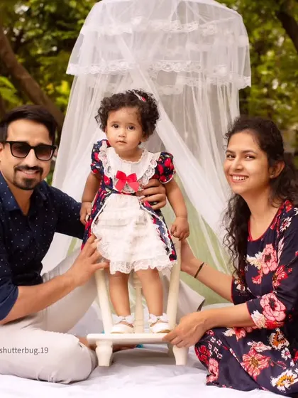 A beautiful family portrait taken during an outdoor canopy session, capturing the love and connection between them.