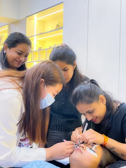 Our small batches mean you get the personal attention you deserve. Here, our instructor guides students through the delicate process of lash application on a live model, ensuring every detail is perfect.