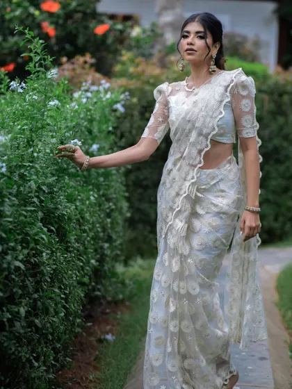 A full-length shot of the white saree, perfect for a sophisticated and understated look.