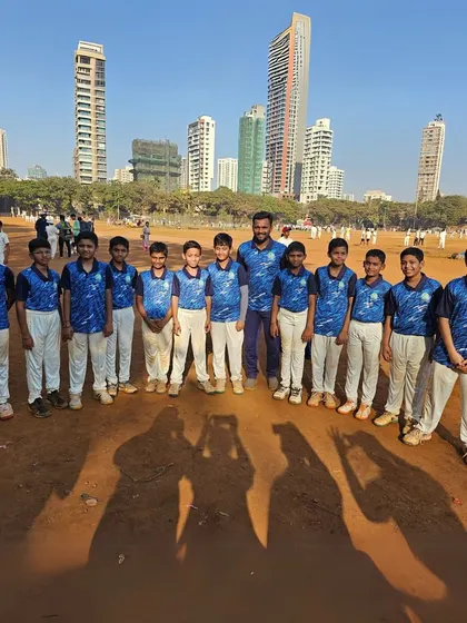 Our team poses against the Mumbai skyline, a powerful backdrop for their big dreams. These young cricketers are ready to make their mark in the city's competitive sports scene.