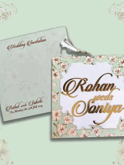 This light green laser-cut invitation is adorned with lily flowers and a tassel, offering a fresh and elegant design.