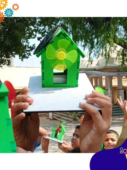Harnessing the power of the sun. Students at the New Activity School in Mumbai hold up the solar-powered fans they built during a workshop on renewable energy.
