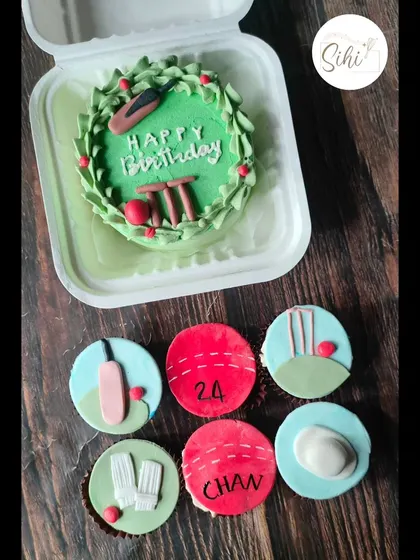 This cricket themed bento cake and cupcake set is perfect for a party. The mini cake features a "Happy Birthday" message on a pitch, with matching fondant toppers on the cupcakes.