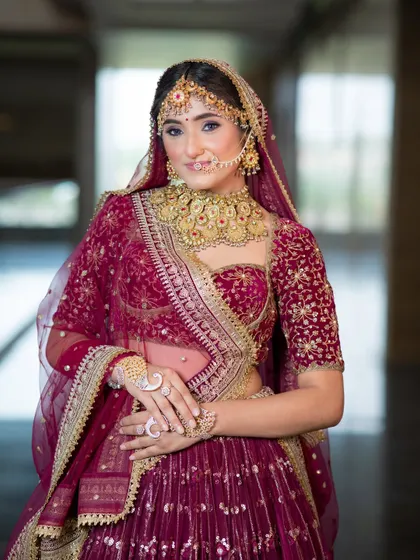 A half-length portrait of this royal bride. The soft blush and structured brows frame her face beautifully, while the makeup remains elegant and not overpowering, even with the heavy jewellery.