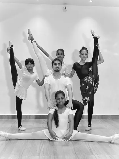 A slightly different take of our impressive ballet group pose, showcasing the strength and skill of my students.